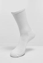 White Tuftinglove crew socks featuring vertical ribbed cuff and cotton blend material