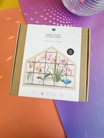 Rico Design Orchids embroidery kit box front view with orange and purple background