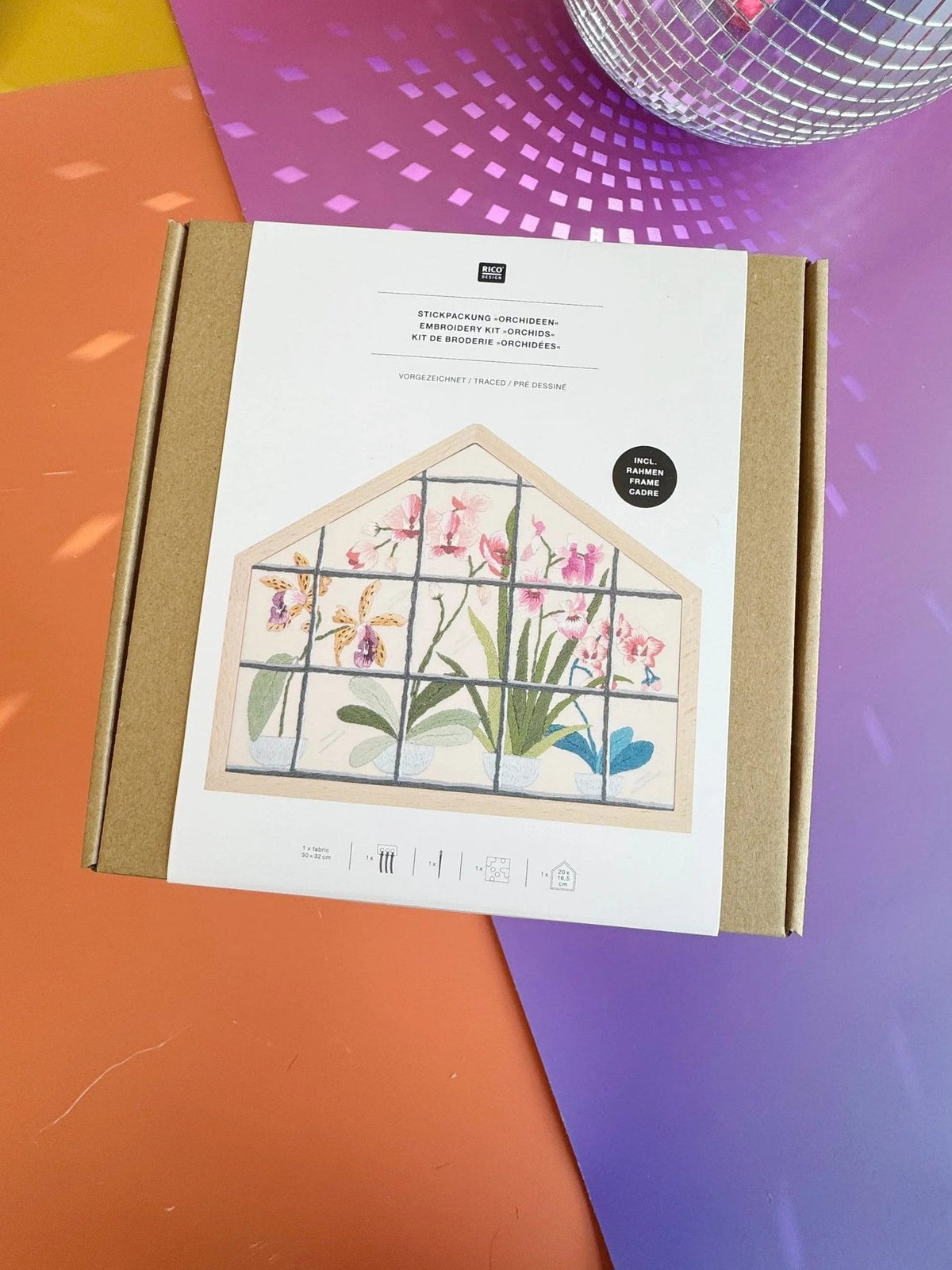 Rico Design Orchids embroidery kit box front view with orange and purple background