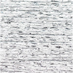 Close-up of shimmering silver metallic embroidery thread texture