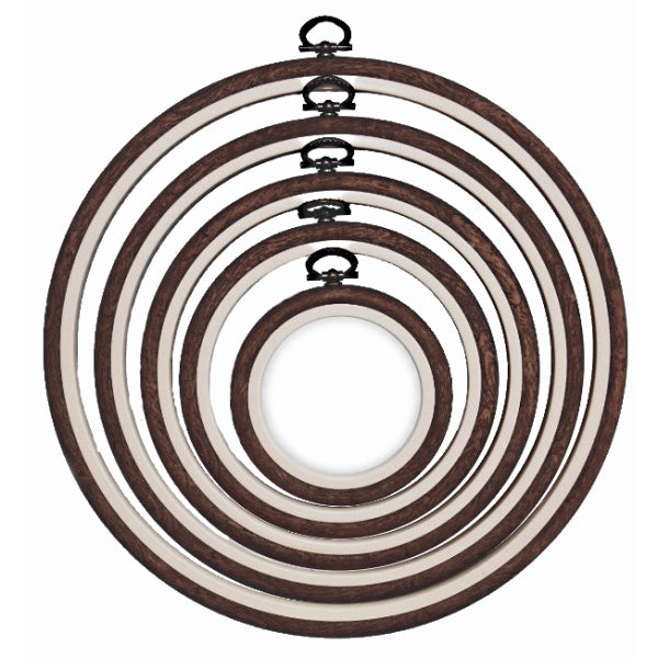Nurge round flexi hoop holding a finished hoop art