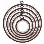 Nurge round flexi hoop holding a finished hoop art