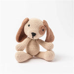 Beige and brown amigurumi crochet dog with floppy ears and safety eyes