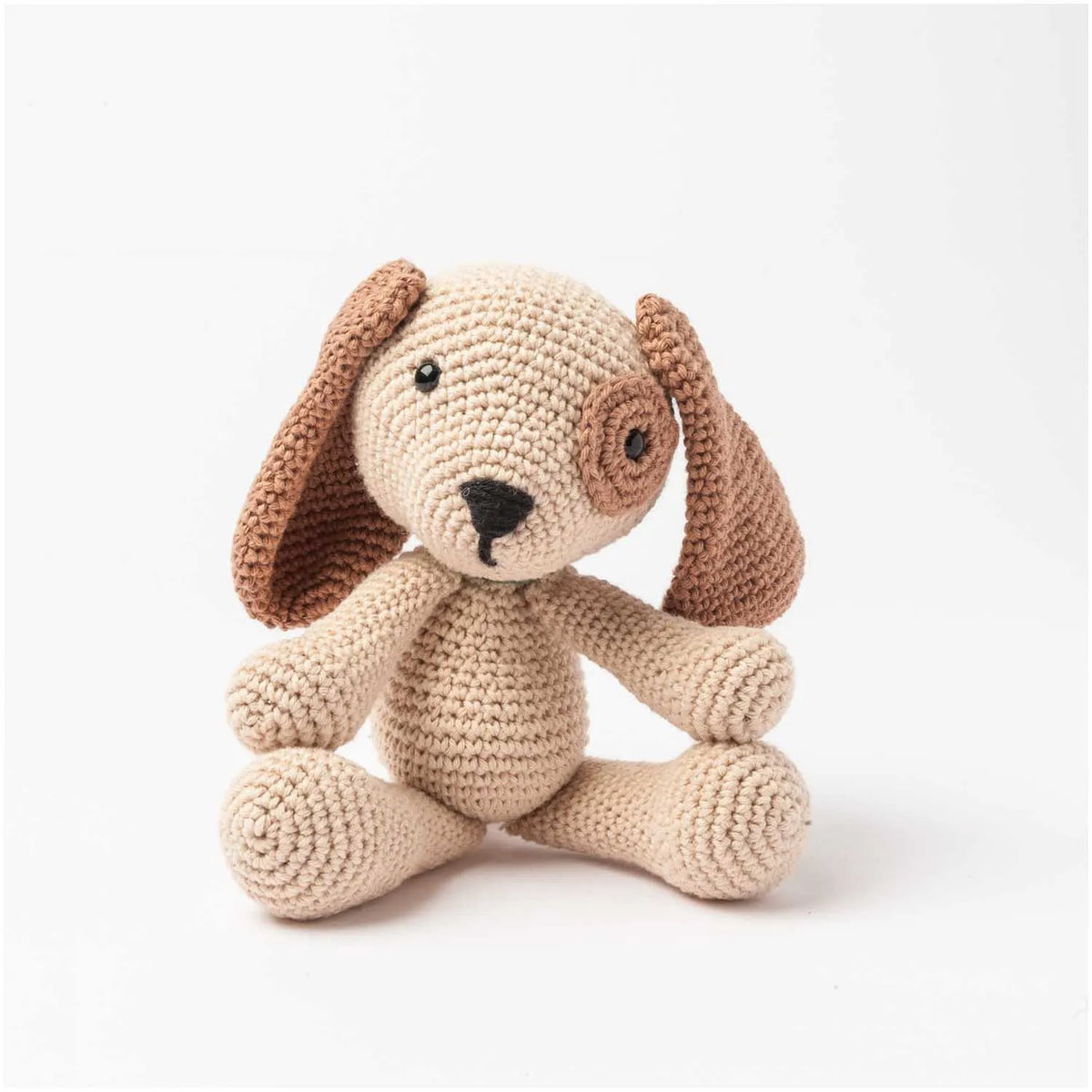 Beige and brown amigurumi crochet dog with floppy ears and safety eyes
