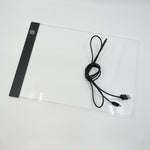 A4 light pad in use tracing a design