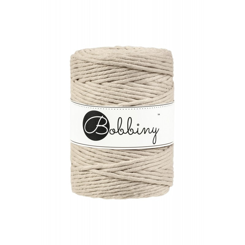 Beige cotton macrame cord single-twist texture close-up