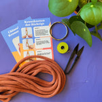 Chunky macrame plant hanger holding a pot
