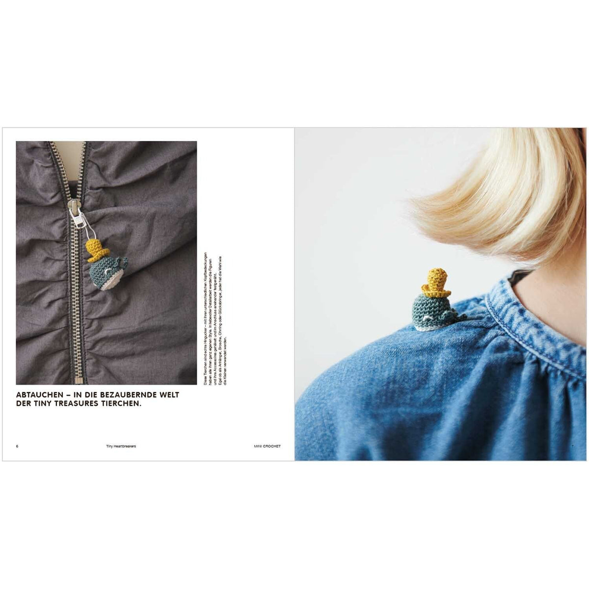 Tiny crocheted whale brooch on jacket zipper and denim shirt shoulder
