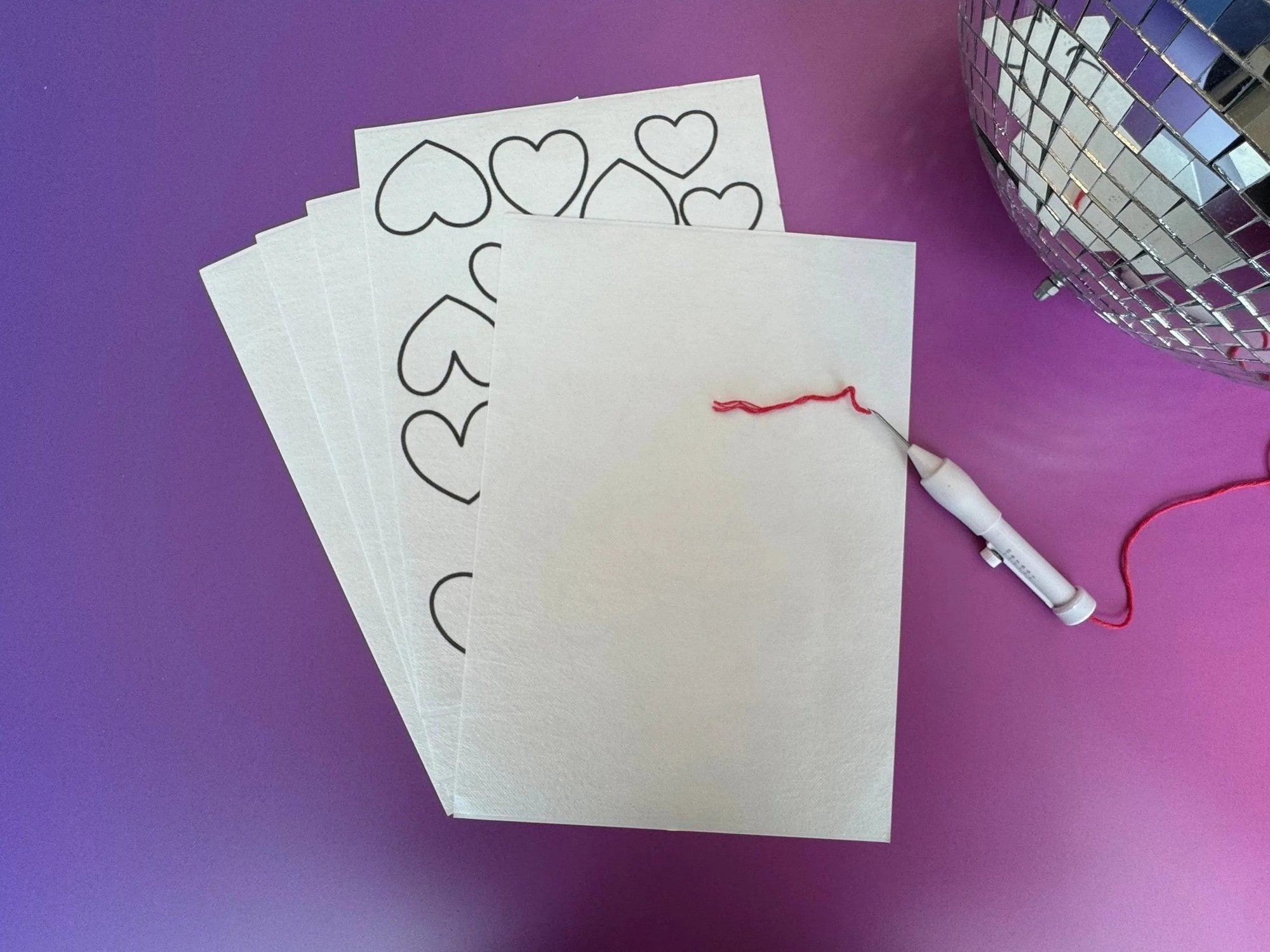 Printable A4 embroidery paper with heart design, punch needle tool, and water-soluble mesh for crafting