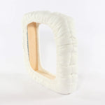 Side view of white elasticized fleece frame cover showing thickness and gathered texture