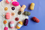 Video tutorial for Punch Needle Set displayed with practice piece and multicolored yarn