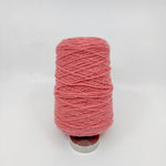 Tufting wool cone close-up showing yarn texture