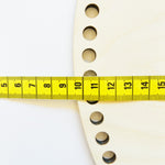 Wooden moses basket board with drilled holes